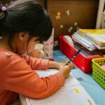 An infographic explaining what number sense is, showing examples like counting apples, comparing groups, and a child playing with blocks.
